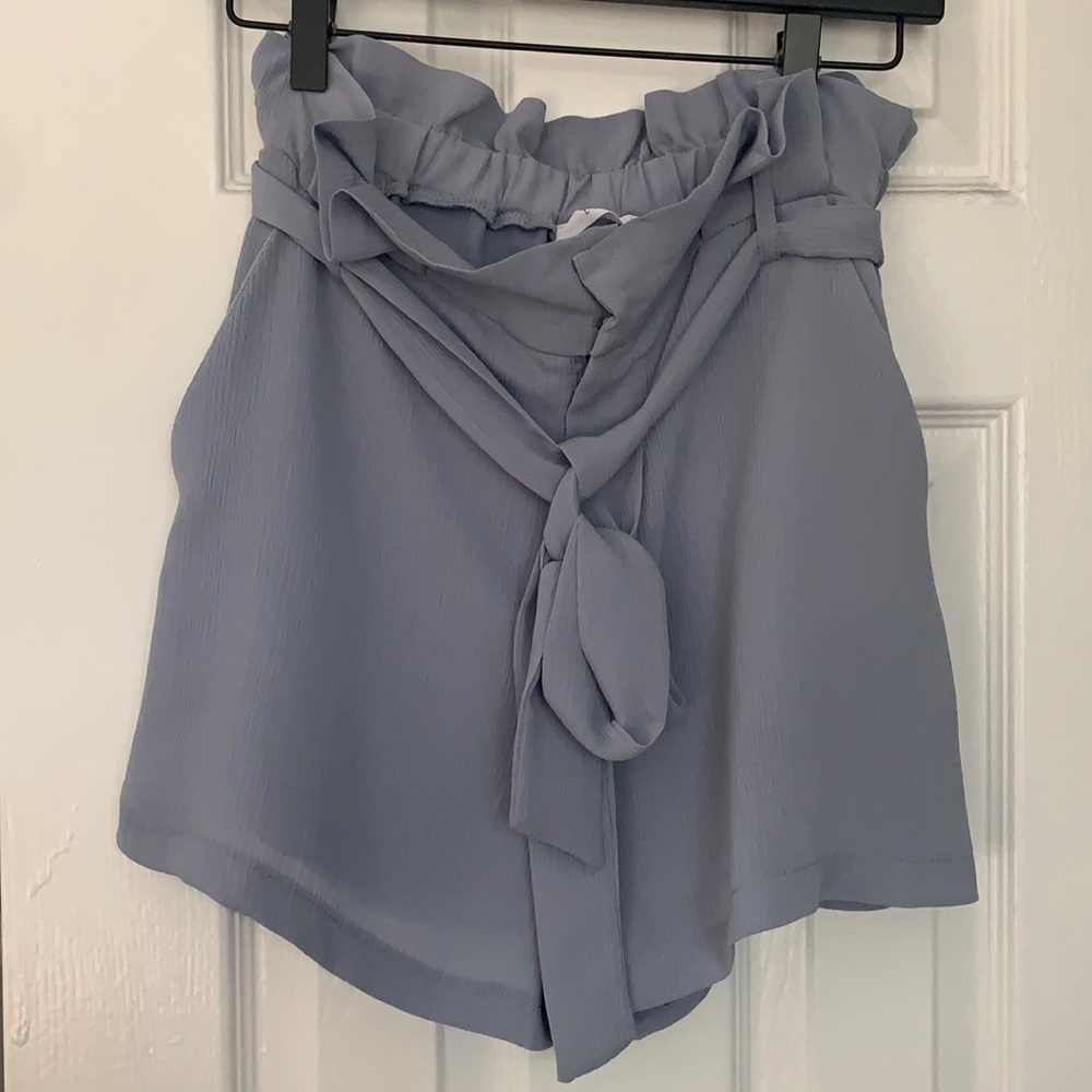 Light blue paper bag shorts with pockets and tie